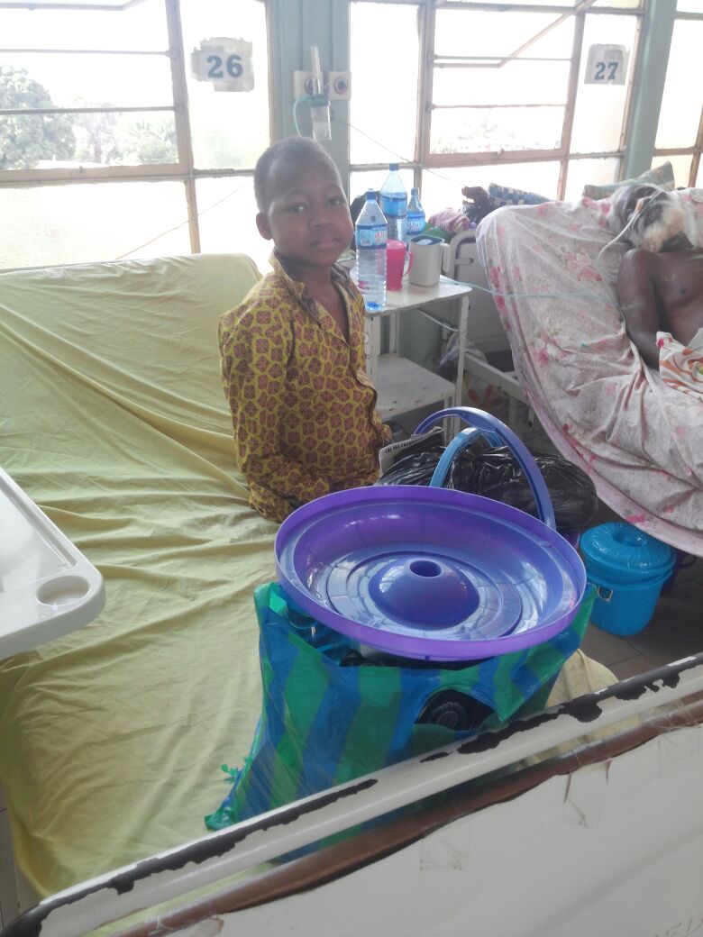 Photo of a sick child and an old man in the hospital .