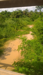 Destroyed river in the country Ghana due to illegal mining .